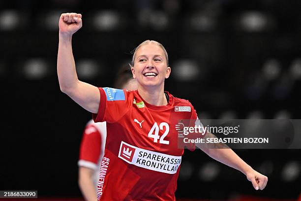 Denmark's left back Michala Elsberg Moller celebrates after scoring a goal during the women's EHF 2024 European championship handball game between...