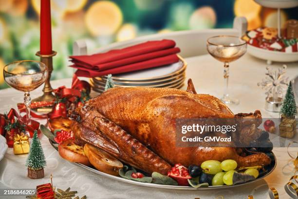 roasted holiday goose with vegetables for christmas dinner - goose meat stock pictures, royalty-free photos & images