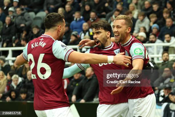 Tomas Soucek of West Ham United celebrates scoring his team's first goal with teammates Lucas Paqueta and Max Kilman during the Premier League match...