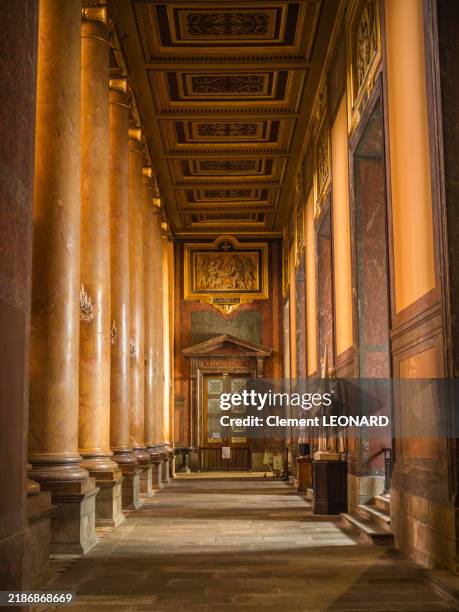 close-up view of a side aisle of the rennes cathedral (saint peter cathedral), decorated with a painted wooden ceiling, religious statues, wall paintings and architectural marble ionic columns, ille-et-vilaine - bretagne (brittany) - western france. - rennes france stock pictures, royalty-free photos & images
