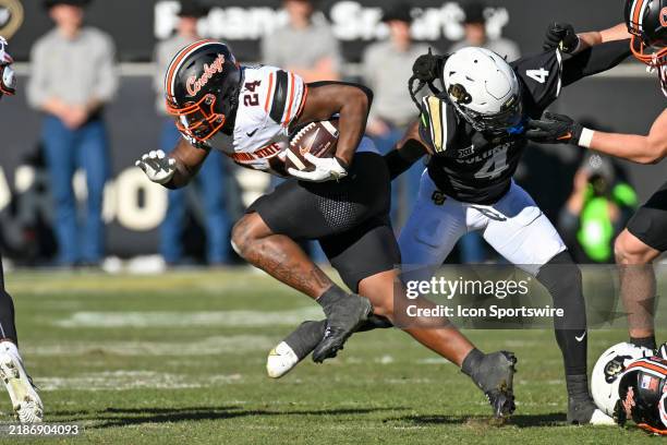 Oklahoma State running back Trent Howland runs the ball during the college football game between the Oklahoma State University Cowboys and the...