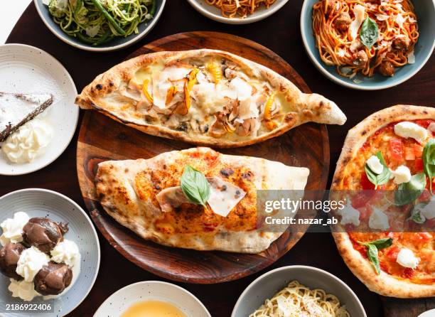 table top of flat lay of italian dishes. - convenience food stock pictures, royalty-free photos & images