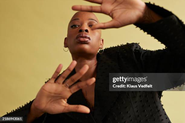 non-binary person showing stop gestures - druck durch gleichaltrige stock-fotos und bilder
