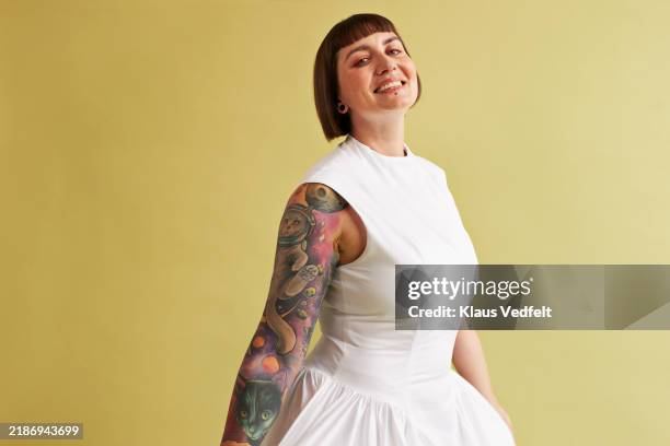 portrait of happy woman with tattooed arm - white dress stock pictures, royalty-free photos & images