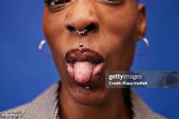 non-binary person sticking out tongue - human tongue stock pictures, royalty-free photos & images
