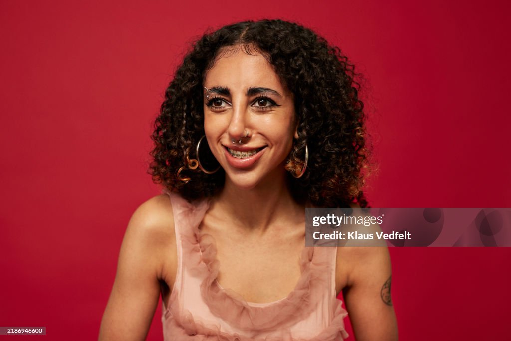 Smiling non-binary person with dental braces