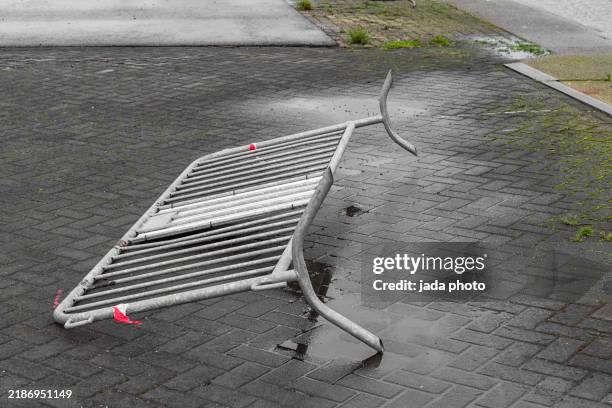 steel crush barrier that has fallen is lying outside on the street - new hampshire road sign stock pictures, royalty-free photos & images