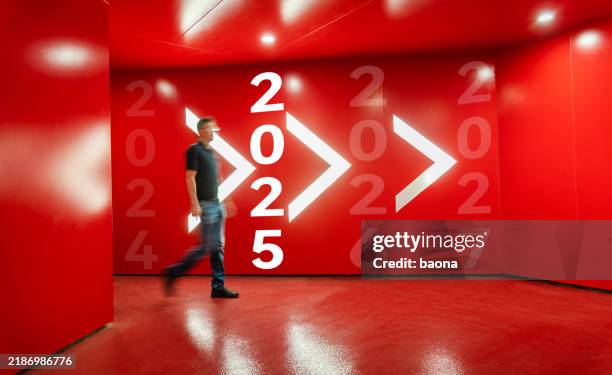 man walking frome 2024, to 2025, new year concept - guess jeans stock pictures, royalty-free photos & images