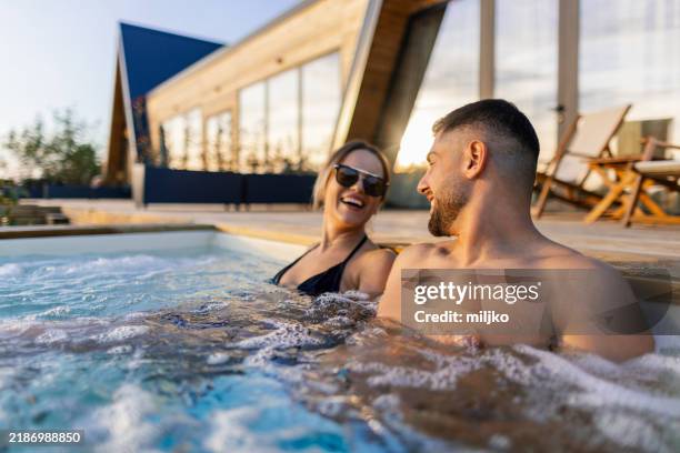 couple enjoying outdoor hot tub - spa bildbanksfoton och bilder