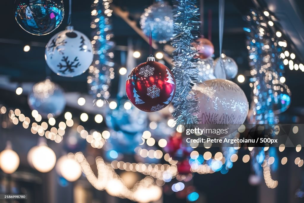 A photo of a Christmas background with hanging baubles