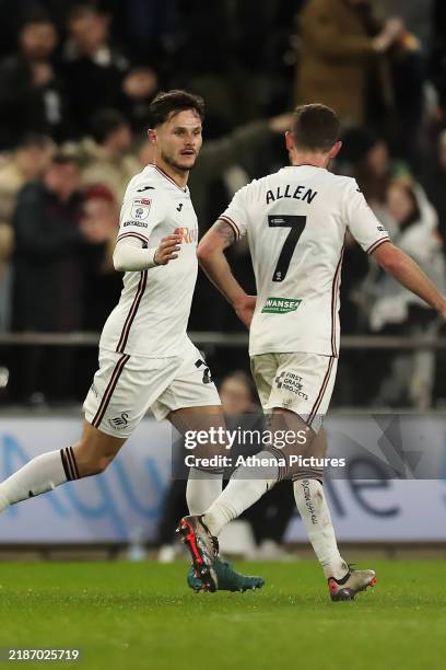 Liam Cullen of Swansea City celebrates scoring his team's second goal with Joe Allen during the Sky Bet Championship match between Swansea City and...