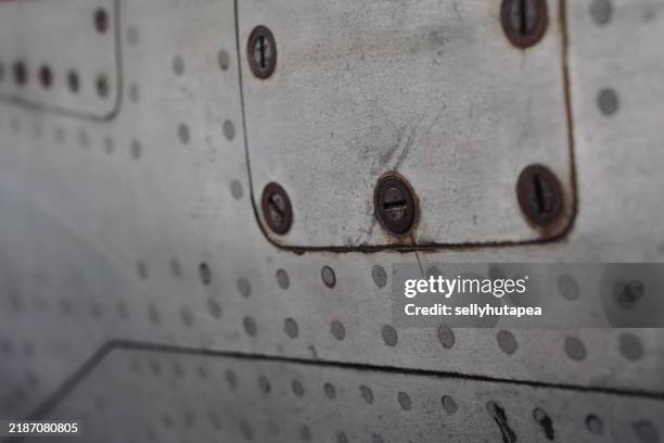 airplane metal texture with screws and rivets - veículo blindado imagens e fotografias de stock