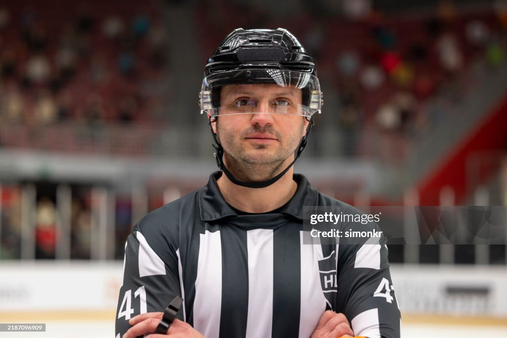 Ice Hockey Referee in Focused Stance