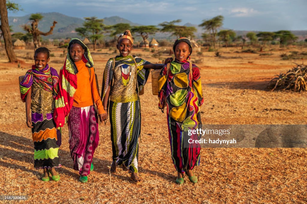 Young African women carrying water from the well, Ethiopia, Africa