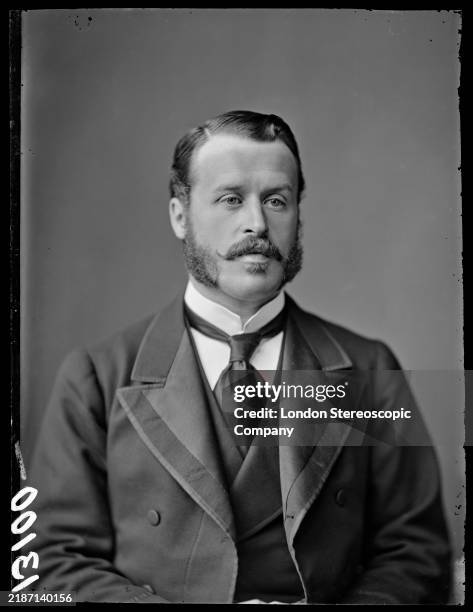British politician Frederick Campbell, wearing a black jacket over a black waistcoat, a white shirt and black tie, in a studio portrait, United...