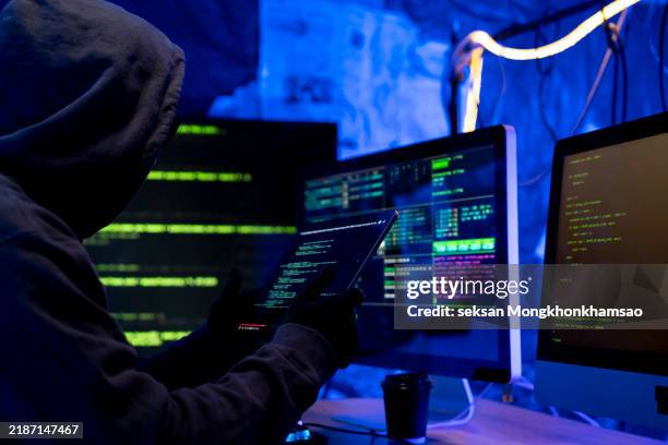 hacker, it and person with code on computer, programming and phishing scam with malware or virus. hacking, system glitch and cloud computing error in dark room, cyber crime and cybersecurity fail - corporate theft stock pictures, royalty-free photos & images