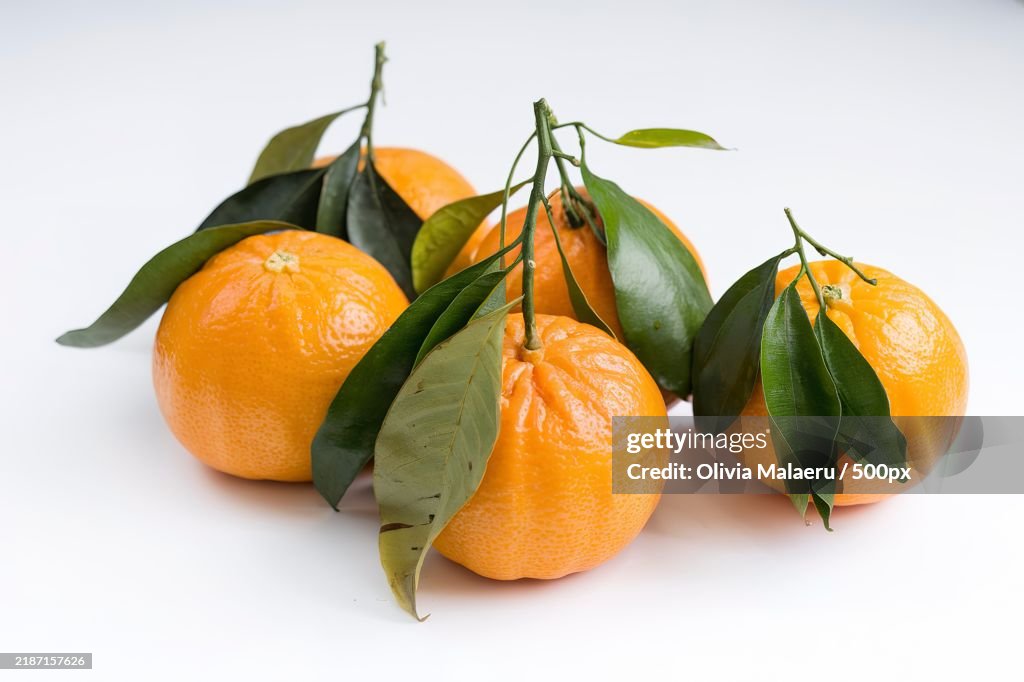 Ripe mandarins,Tangerines with leaves on a white background