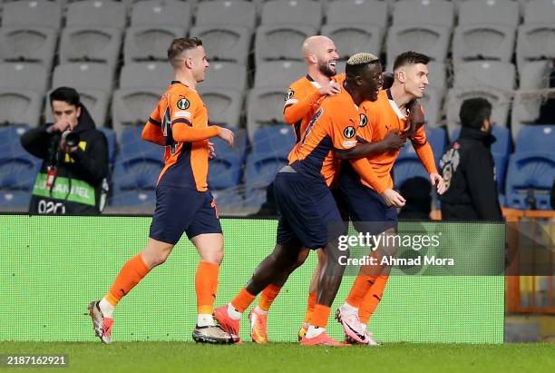 Krzysztof Piqtek of Istanbul Basaksehir F.K celebrates scoring his team's first goal from a penalty kick with teammates during the UEFA Conference...