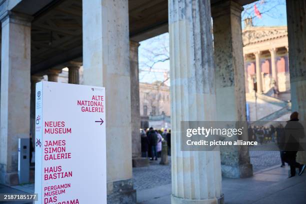 December 2024, Berlin: A queue of people stands in front of the Alte Nationalgalerie on Museum Island: today is the last free museum Sunday for the...