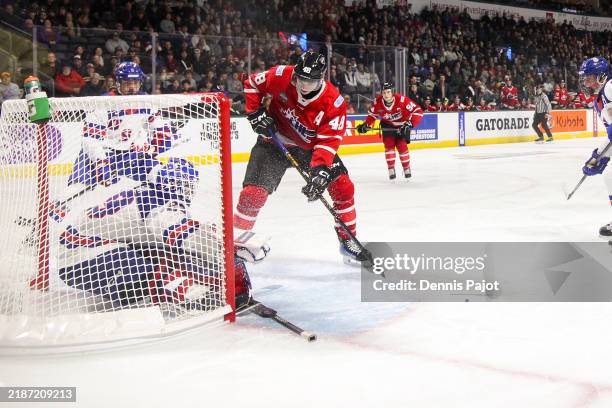 Defenceman Matthew Schaefer of Team CHL scores his second period goal against goaltender Patrick Quinlan of Team USA during the CHL USA Prospects...