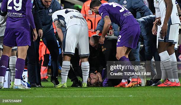 Fiorentina's Italian midfielder Edoardo Bove is treated after suddenly collapsing to the ground during the Serie A football match between Fiorentina...
