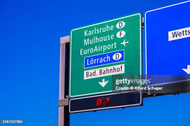directional sign to euroairport in basel switzerland - loerrach stock pictures, royalty-free photos & images