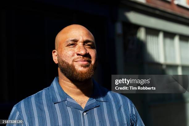 man looking up on city street - modern manhood stock pictures, royalty-free photos & images