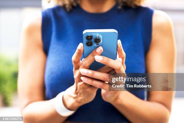 close up of woman using smart phone - brand name smart phone stock pictures, royalty-free photos & images