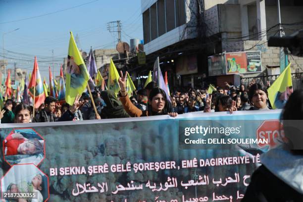 Syrian Kurds demonstrate in the northeastern city of Qamishli on December 2, 2024 to protest against the attacks by Turksih-backed fighters on areas...