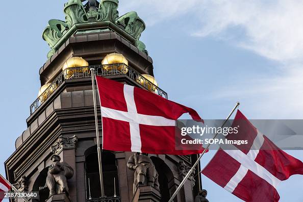 Danish flags flutter at Christiansborg Castle Square in Danish flags flutter at Christiansborg Castle Square in