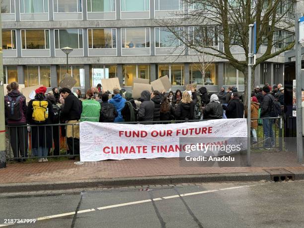 Group of climate activists gather in front of the ICJ building, calling for urgent action against the impacts of climate change as the advisory...