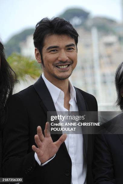 Japanese actor Takeshi Kaneshiro poses during the photocall of "Wu Xia" presented as part of the Sceances de Minuit selection at the 64th Cannes Film...