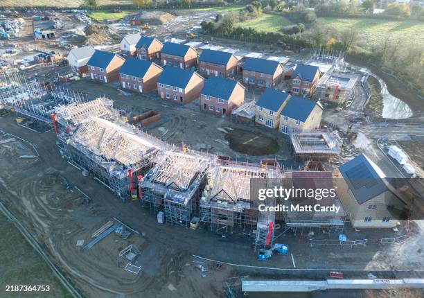 Aerial view of new houses being constructed on what was previously agricultural land on November 30, 2024 in Trowbridge, England. The new Labour...