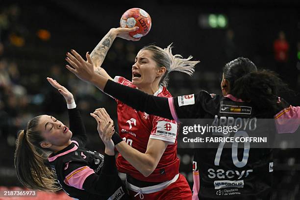 Poland's left back Aleksandra Rosiak fights for the ball with Spain's left back Paula Arcos Poveda and Spain's left back Carmen Arroyo Pimienta...
