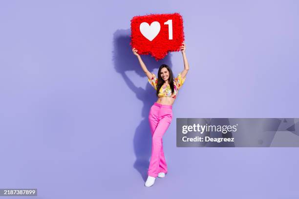 Full length photo of adorable positive person arms hold large like collage isolated on violet color background