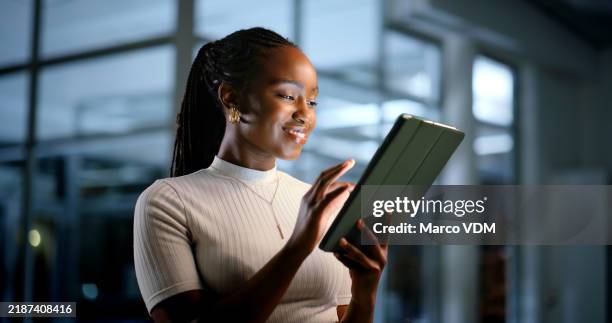 tablet, night and happy black woman in business to research market, development or review design for ads in startup. technology, smile and creative brand consultant with campaign feedback on overtime - african ethnicity stock pictures, royalty-free photos & images