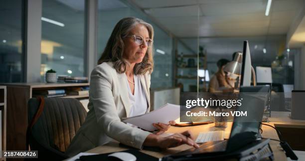 woman, night and laptop for financial email to client, communication and budget paperwork. mature person, manager and online for investment report on stock market, accounting and feedback in office - finansiell rådgivare bildbanksfoton och bilder