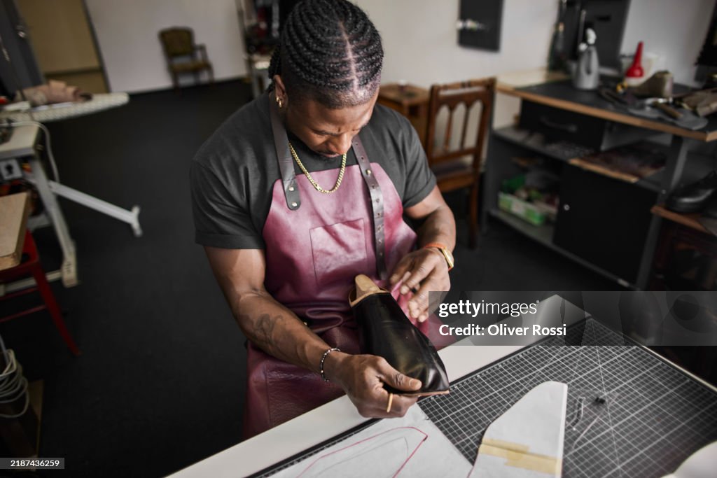 Shoemaker at work in his workshop