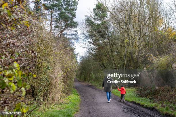 muddy walks with daddy - black boots back view stock pictures, royalty-free photos & images