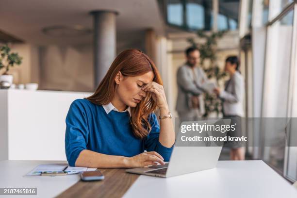 a tired businesswoman is working in the office - stress bildbanksfoton och bilder