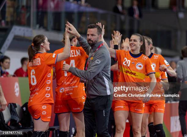 Innsbruck, AUSTRIA Henrik Signell, head coach of Netherlands celebrates with his Team after the EHF Womem`s Euro 2024 match between Netherlands and...