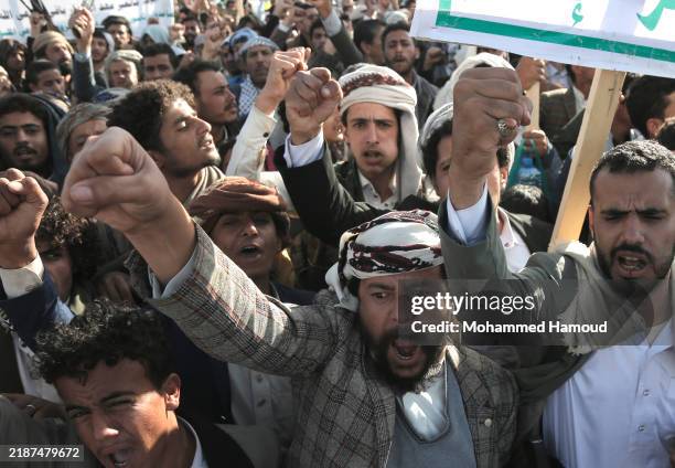 Yemen's Houthi followers chant slogans as they take part in a protest held in solidarity with Palestine and welcoming the war stoppage in Lebanon, on...