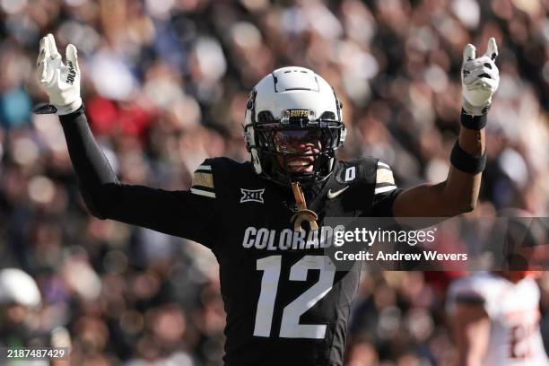 Travis Hunter of the Colorado Buffaloes celebrates a touchdown during the third quarter against the Oklahoma State Cowboys at Folsom Field on...