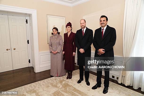 Britain's Prince William, Prince of Wales, and his wife Britain's Catherine, Princess of Wales, greet Qatar's Emir Sheikh Tamim bin Hamad al-Thani...
