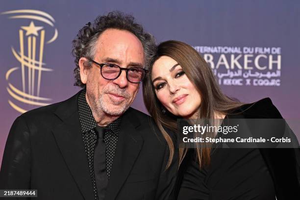 Tim Burton and Monica Bellucci attend the Opening Ceremony red carpet during the 21st Marrakech International Film Festival on November 29, 2024 in...