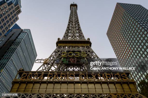 General view shows a replica Eiffel Tower, temporarily installed on the Gwangtonggyo Bridge over the Cheonggyecheon Stream, with Korean lettering...