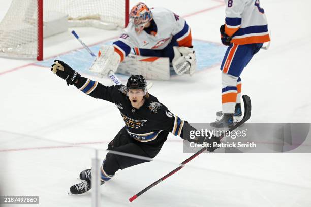 Jakob Chychrun of the Washington Capitals celebrates after scoring the game-winning goal against the New York Islanders during overtime at Capital...