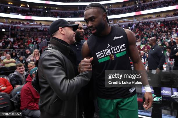 American singer-songwriter and actor Donnie Wahlberg shakes hands with Jaylen Brown of the Boston Celtics before the game against the Chicago Bulls...