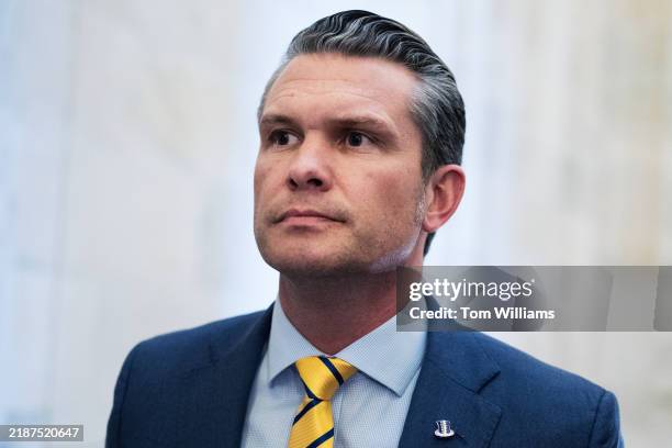 Pete Hegseth, President-elect Donald Trump's nominee to be defense secretary, makes his way to a meeting with Sen. Ted Budd, R-N.C., in Russell...
