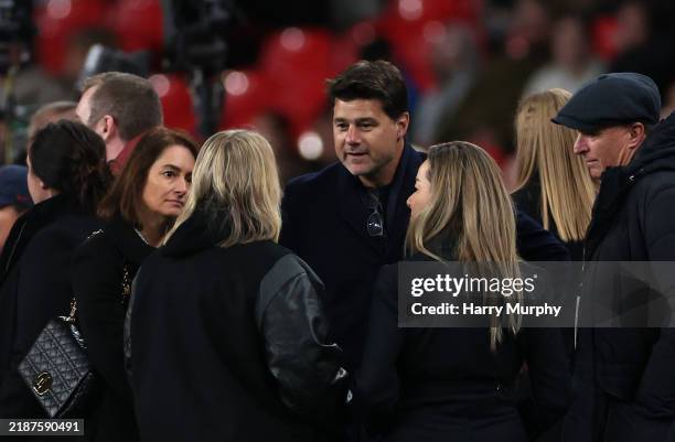 Mauricio Pochettino, former Argentinian football player and current Head Coach of the United States, interacts with Emma Hayes, Head Coach of the...